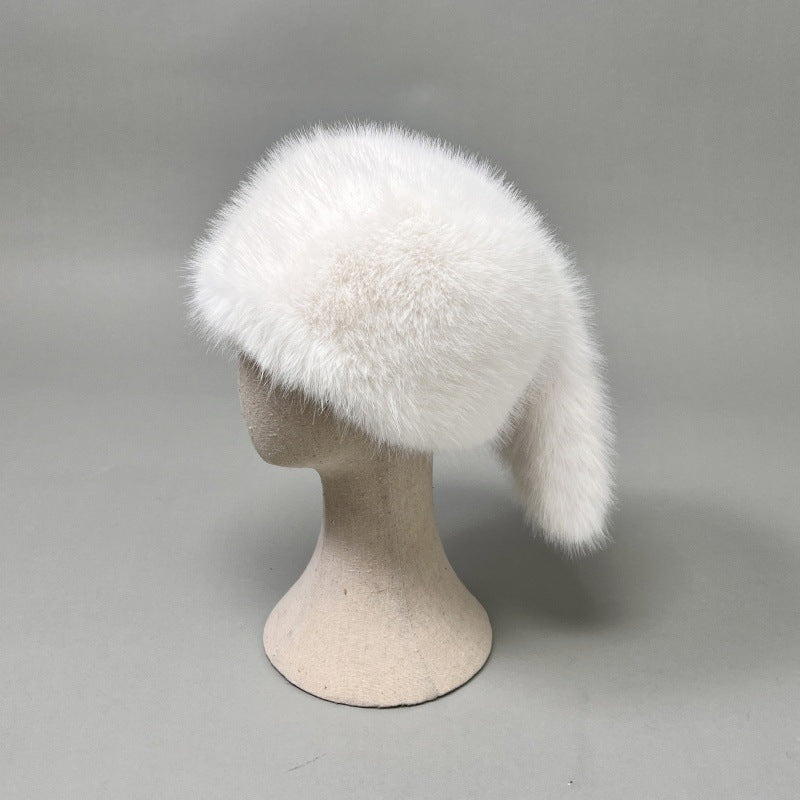 Women’s plush faux fur trapper hat with earflaps and decorative tail Mune Fashion