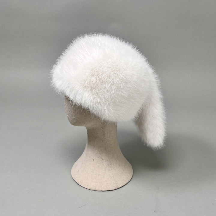 Women’s plush faux fur trapper hat with earflaps and decorative tail Mune Fashion