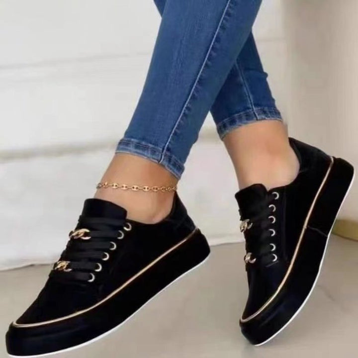 Women's platform sneaker with gold decorative edging and jewelry chain details Mune Fashion