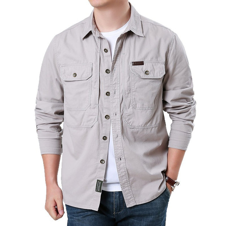Men's casual utility shirt jacket made of cotton twill with two patch breast pockets and buttonable front.