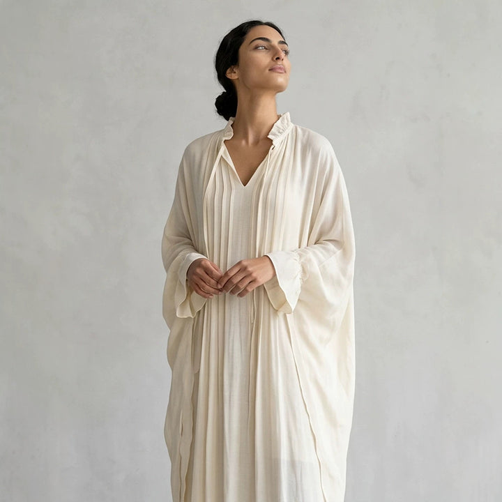Women's maxi dress in kaftan style with ruffled collar, tie straps, and voluminous sleeves Mune Fashion
