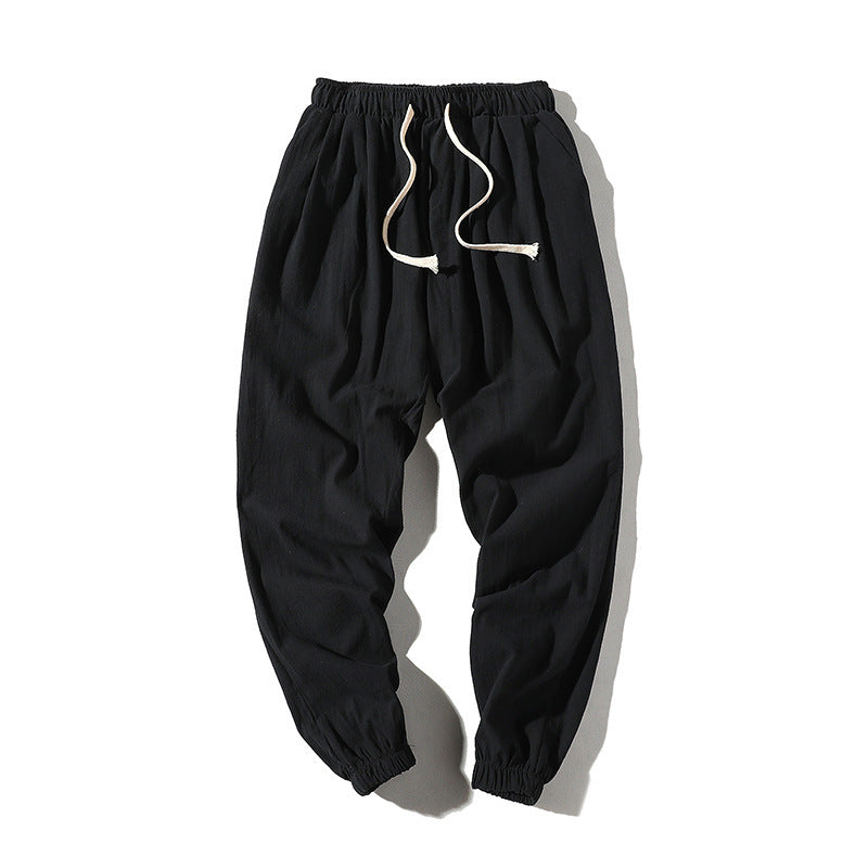 Men's loose joggers with elastic waistband, drawstring, side pockets, and elastic cuffs Mune Fashion