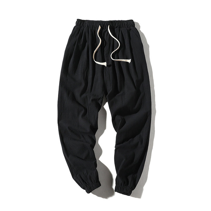 Men's loose joggers with elastic waistband, drawstring, side pockets, and elastic cuffs Mune Fashion