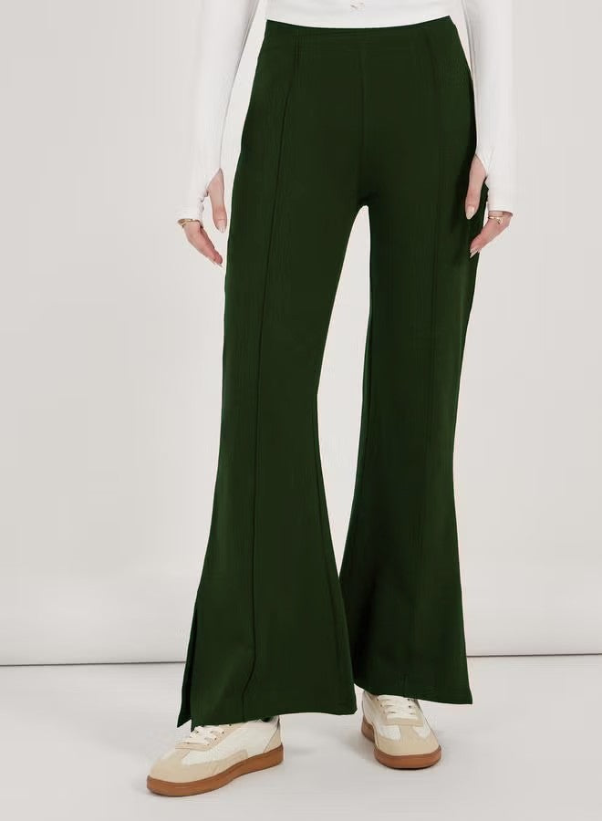 Women’s flared pants with high waist, continuous crease and side hem slit Drune