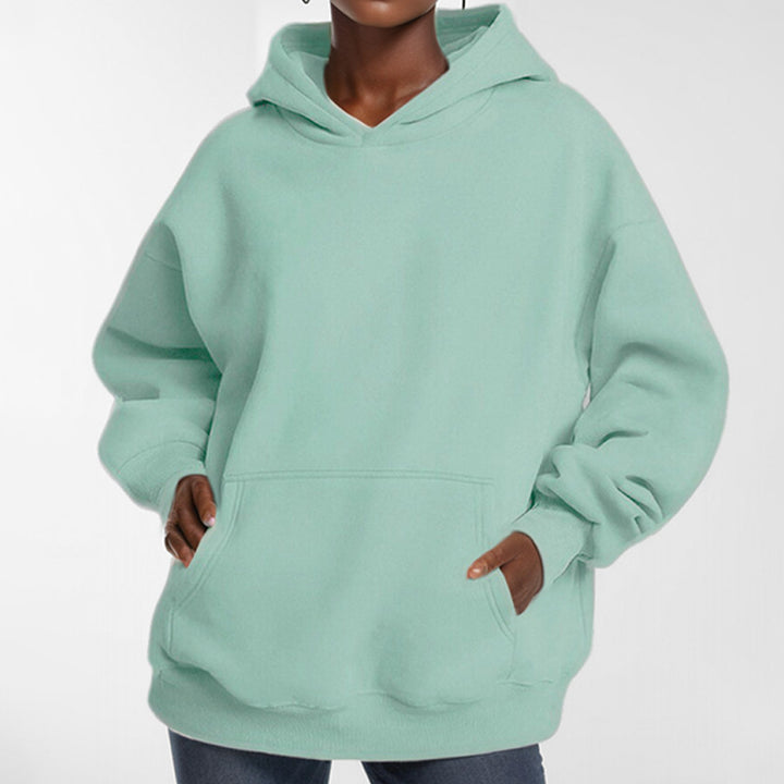 Ladies extra-long oversized hooded sweatshirt with kangaroo pocket, soft fleece lining, and drop shoulder Mune Fashion