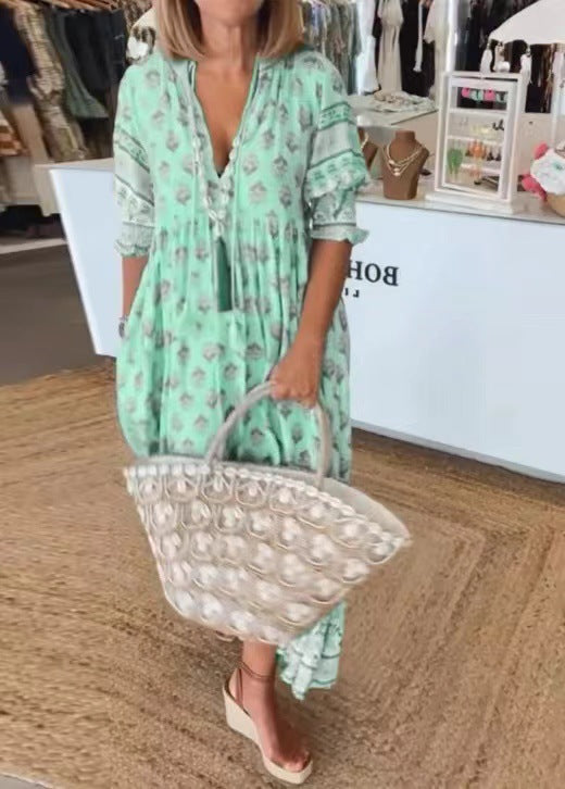 Women Boho Maxi Dress made of lightweight viscose blend with V-neck, tassel tie, three-quarter sleeves, and side pockets Mune Fashion