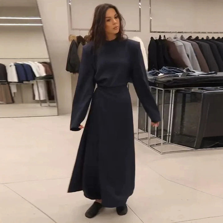 Women’s maxi dress with tailored silhouette, flared skirt and striking shoulders Mune Fashion