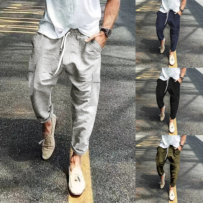 Men's corduroy cargo jogging pants with elastic drawstring waistband, flap pockets, and tapered leg Mune Fashion