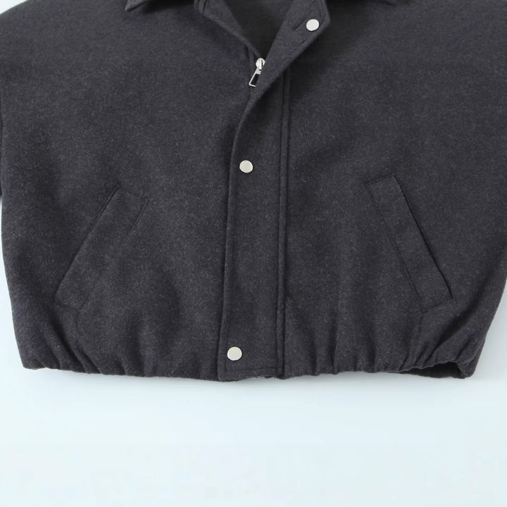 Women's short-cut wool blouson jacket with stand-up collar, snap button placket, and elastic hem Mune Fashion