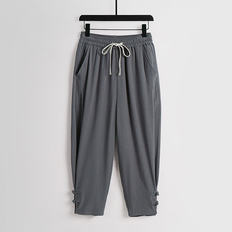 Women's casual jogging pants with drawstring and decorative buttons at the ankle Mune Fashion