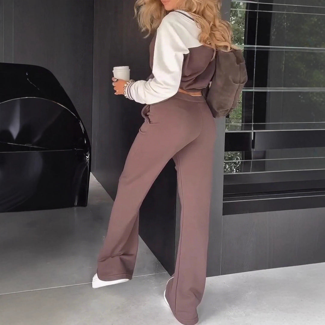 Women's sporty-elegant two-piece set made of cotton blend with V-neck sweatshirt and high-cut flared pants Mune Fashion