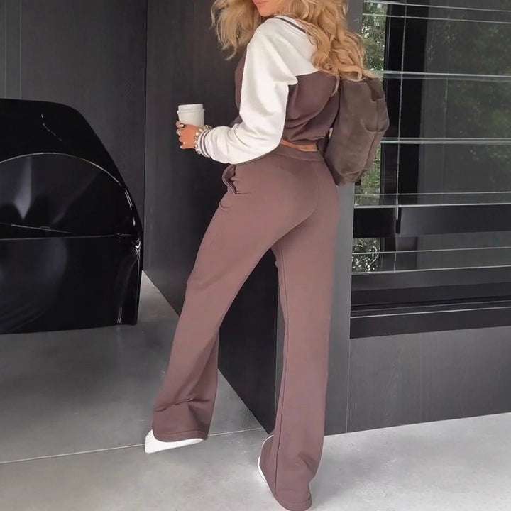 Women's sporty-elegant two-piece set made of cotton blend with V-neck sweatshirt and high-cut flared pants Mune Fashion