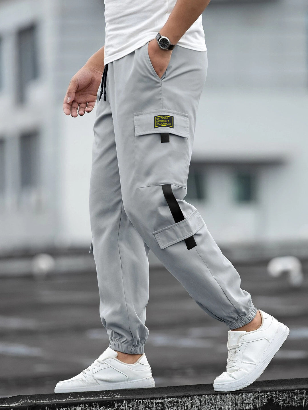 Men's fashionable cargo jogger pants with elastic waistband, drawstring, and multiple security and flap pockets Mune Fashion