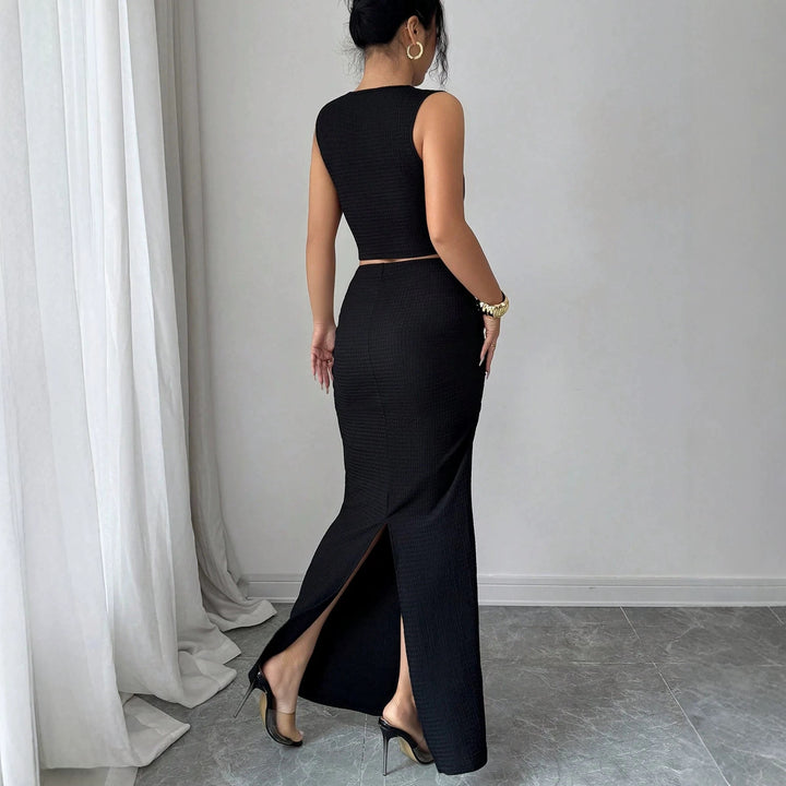 Women's two-piece tailored set with asymmetrical cut-out crop top and figure-hugging maxi pencil skirt Mune Fashion