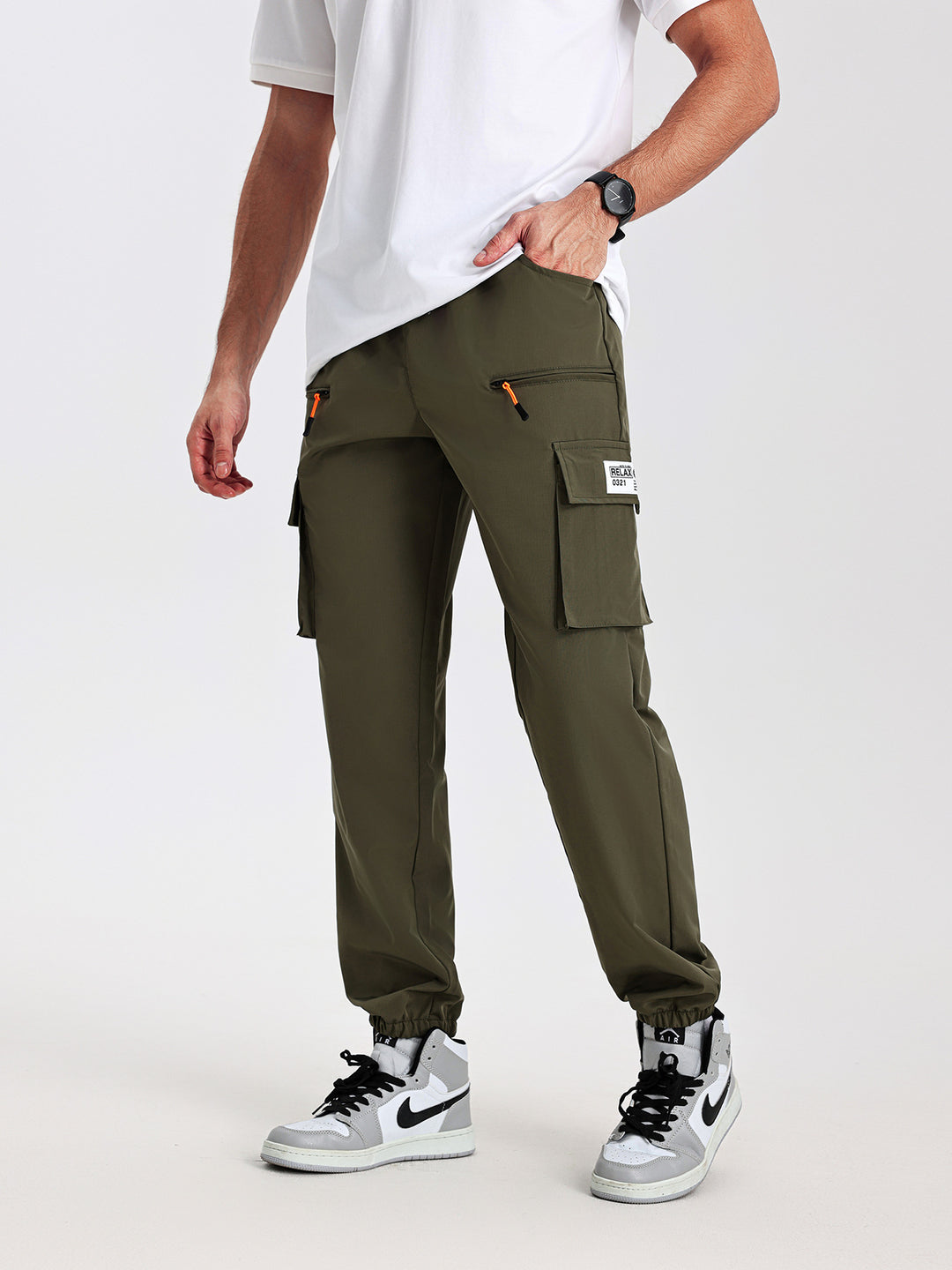 Men's tapered cut utility cargo pants in jogger style with drawstring waistband, zippered pockets & elastic leg cuffs Mune Fashion