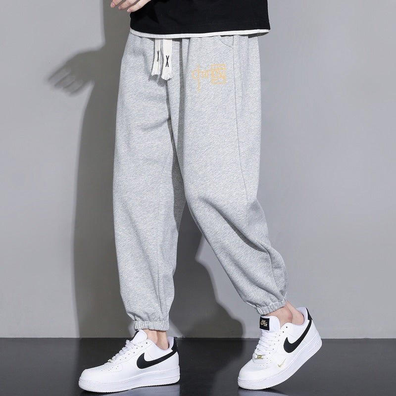 Men's loose fitting sweatpants with drawstring, elastic cuffs, and side pockets Mune Fashion