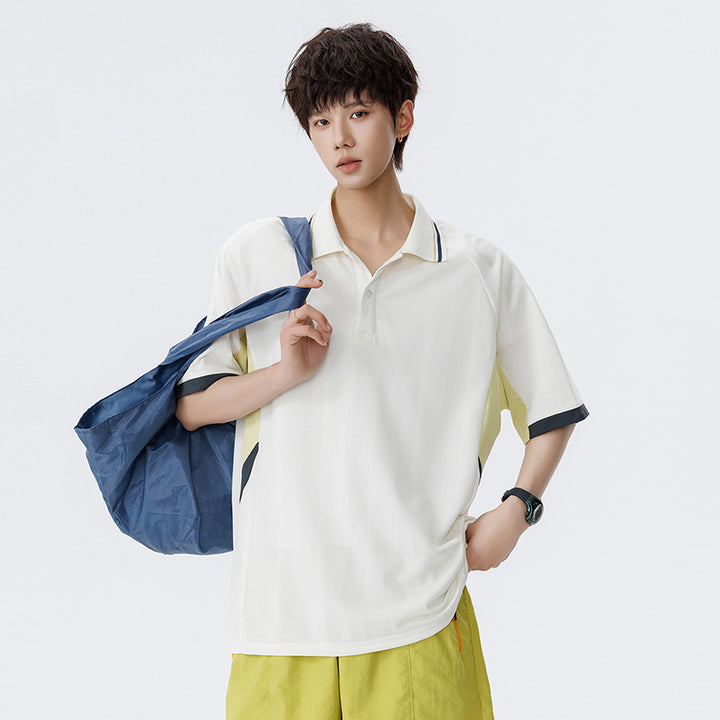 Unisex Boxy Oversize Polo Shirt made of technical functional jersey with contrast panels and raglan sleeves Drune