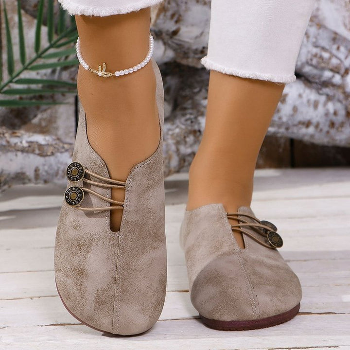 Ladies nan elegant comfort slipper in moccasin style with elastic decorative cord and button detail Mune Fashion