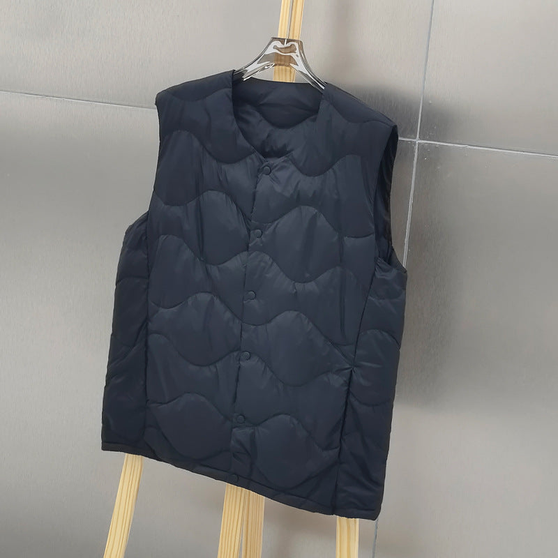 Women’s sleeveless thermal quilted vest with wave-shaped quilting and snap button closure Mune Fashion
