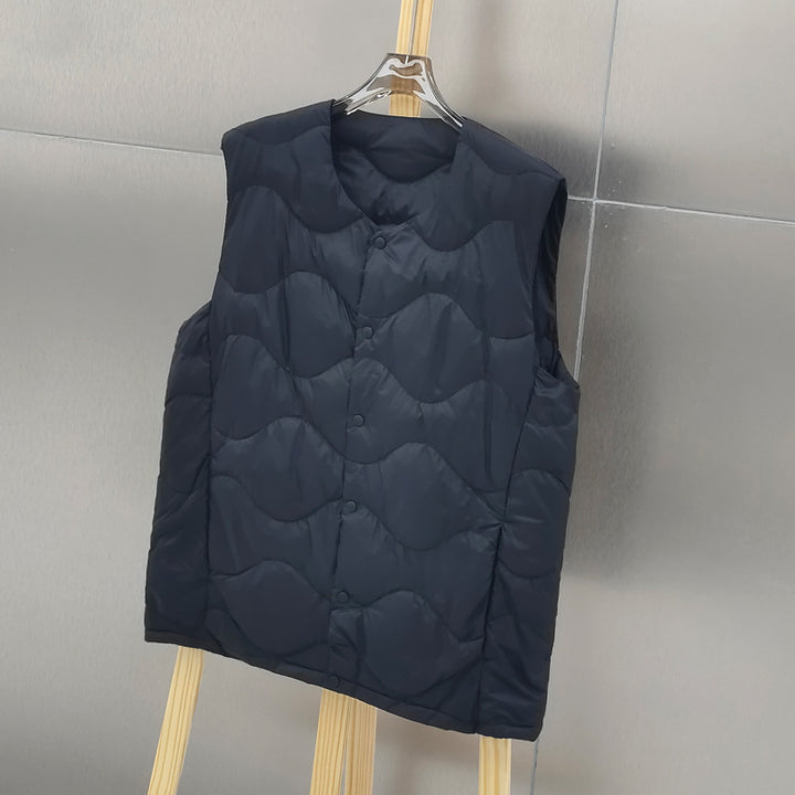 Women’s sleeveless thermal quilted vest with wave-shaped quilting and snap button closure Mune Fashion