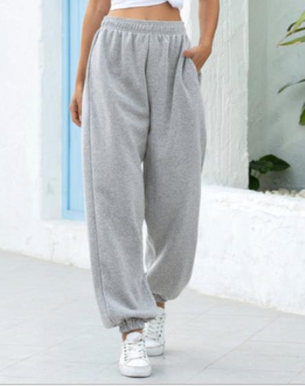 Women's wide High-Waist jogging pants made of soft fleece with elastic waistband, side pockets, and narrow cuffs Mune Fashion