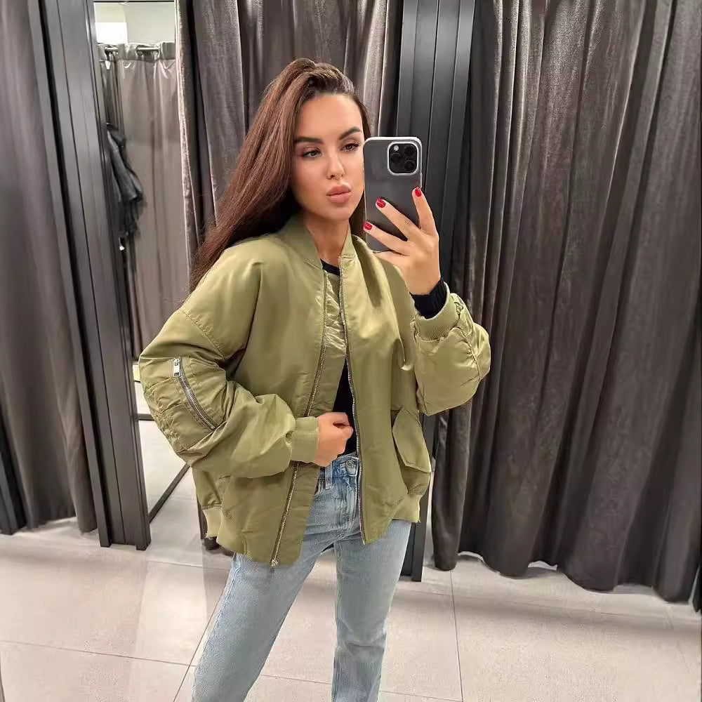 Women's oversized bomber jacket with padded contrast lining, sleeve zipper, and extended hem Mune Fashion
