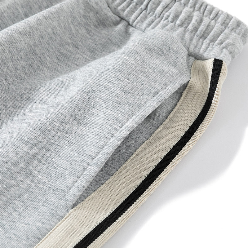 Men's loose-fitting joggers with elastic waistband, drawstring, and contrasting side stripes Mune Fashion