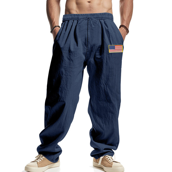 Men's loose-fitting leisure pants in linen look with elastic waist, drawstring & flag patch Mune Fashion