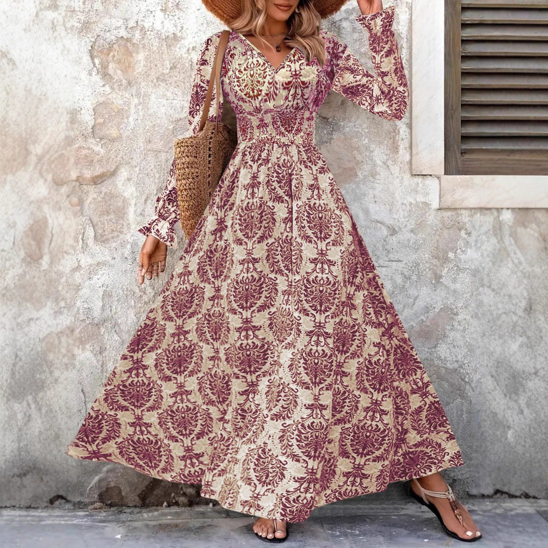 Ladies' feminine flowing maxi dress with V-neck, gathered smock waist area and ornamental all-over print