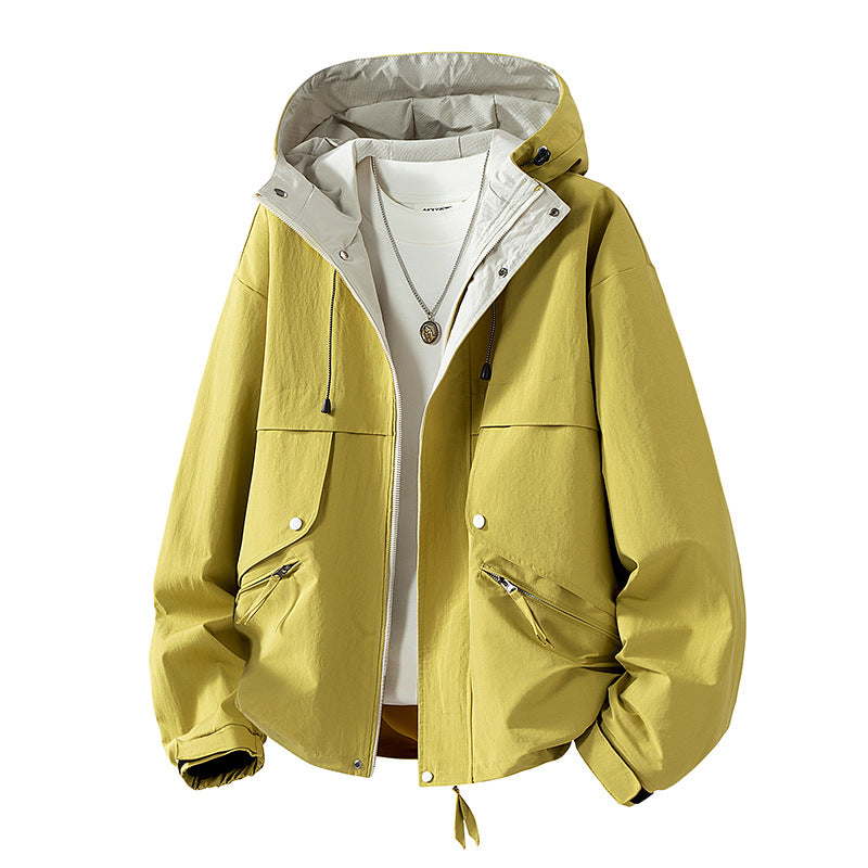 Unisex lightweight windproof transitional jacket with adjustable hood, drawstring, and zippered pockets Mune Fashion