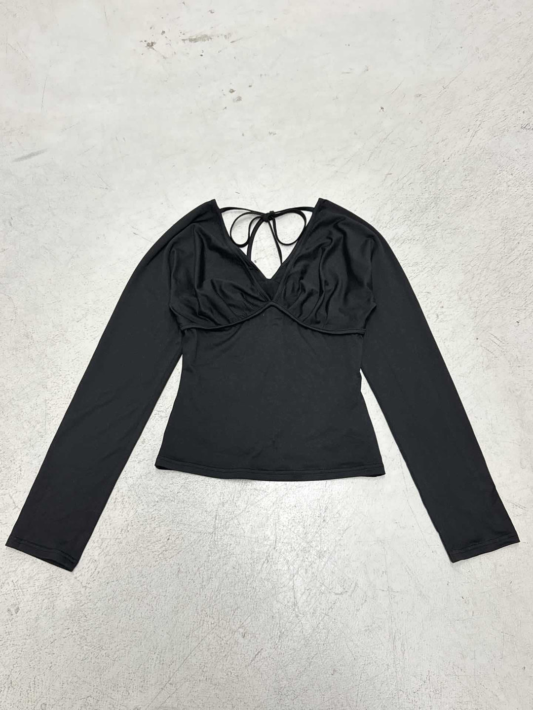 Women's figure-hugging long-sleeve top with deep V-neckline, neck tie for binding, and tailored silhouette Mune Fashion