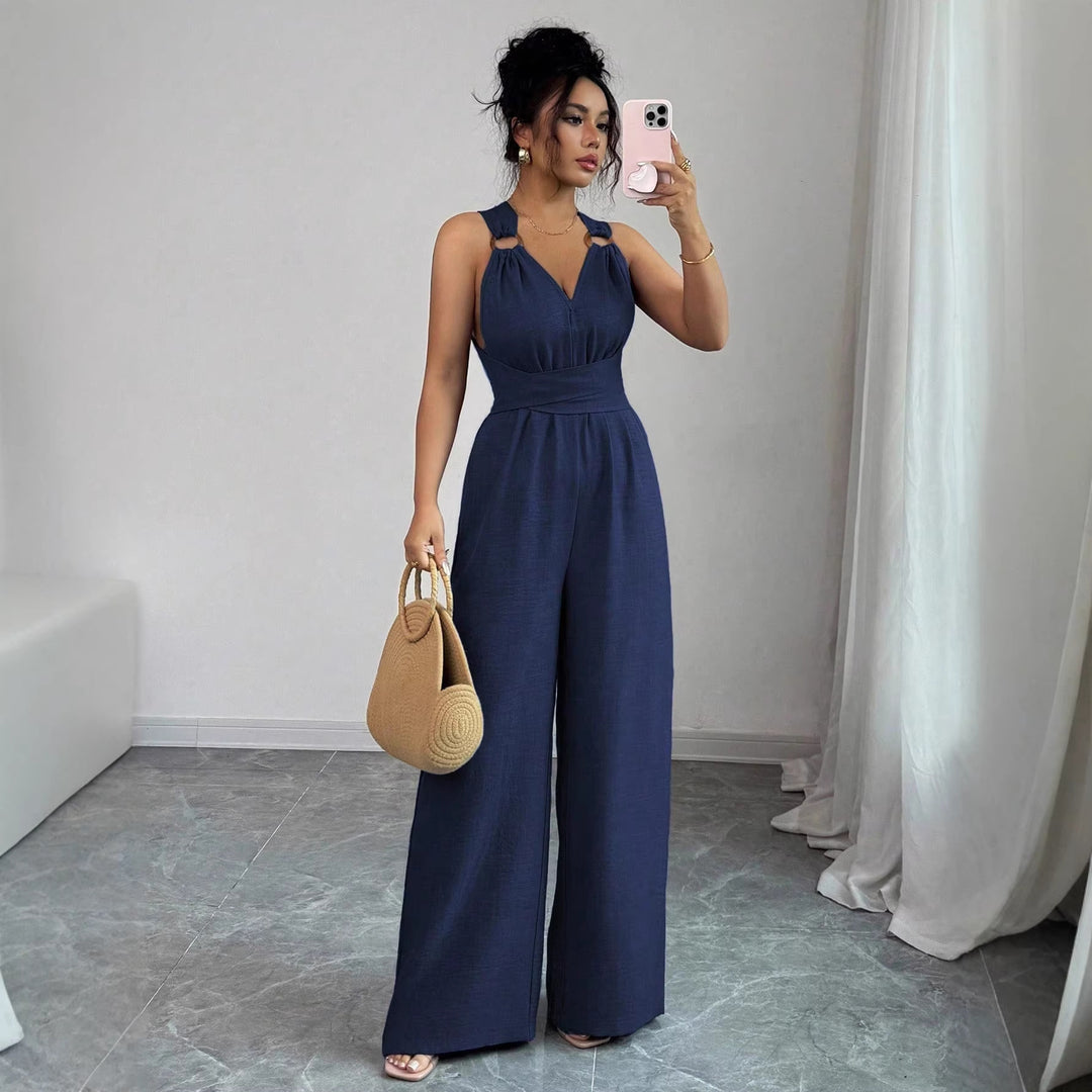 Women’s jumpsuit with wide leg, tailored wrap belt and eyelet straps Mune Fashion