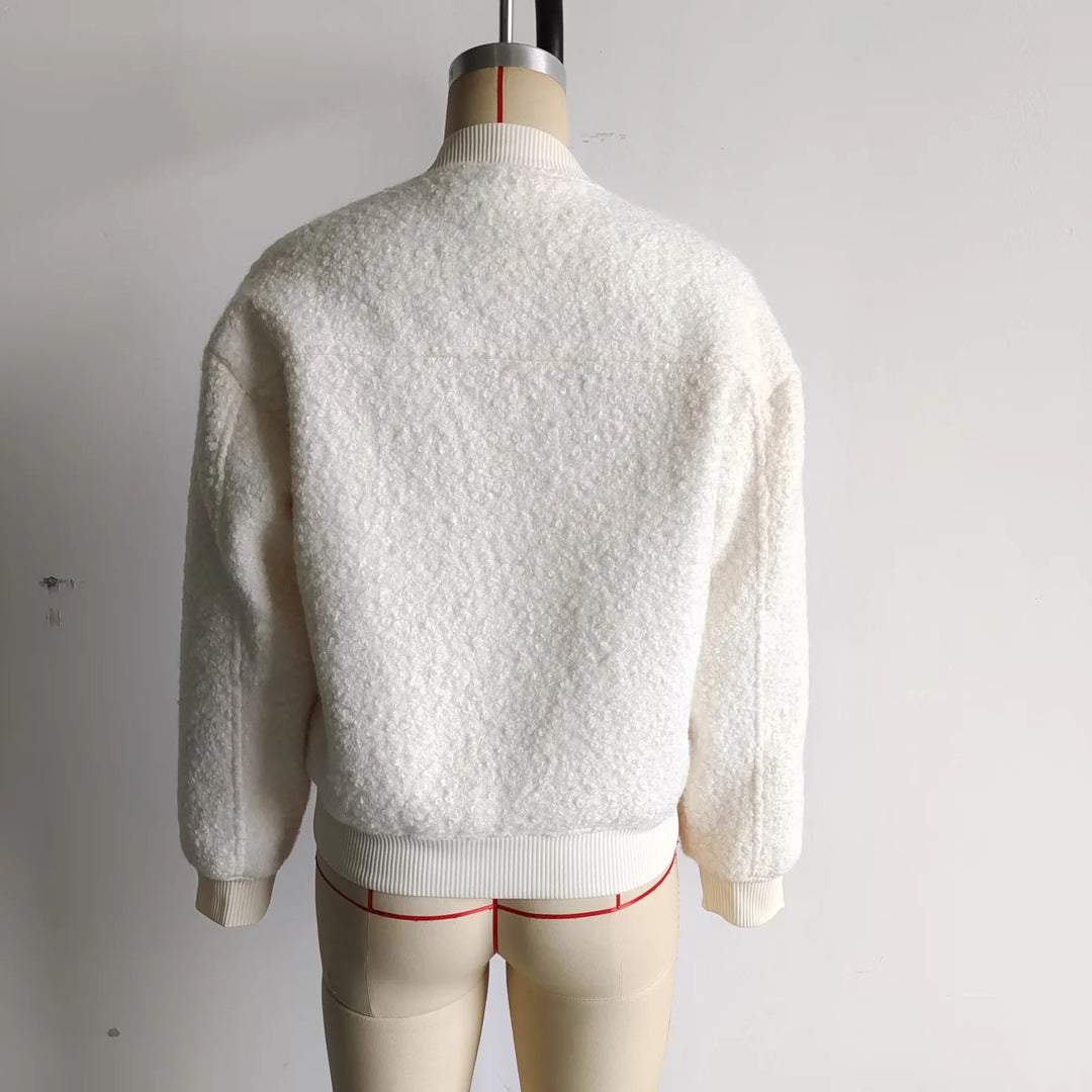 Ladies cozy teddy bomber jacket in college style with concealed snap button placket and integrated pockets Mune Fashion
