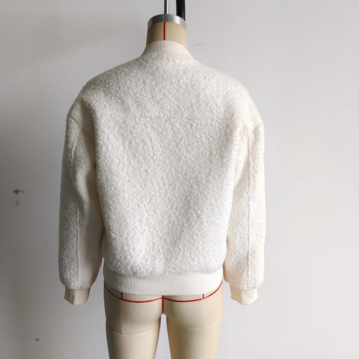 Ladies cozy teddy bomber jacket in college style with concealed snap button placket and integrated pockets Mune Fashion