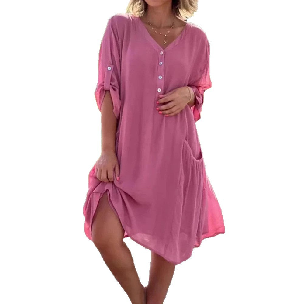 Women's lightweight V-neck beach dress with button placket, rolled sleeves, and patch side pockets Mune Fashion