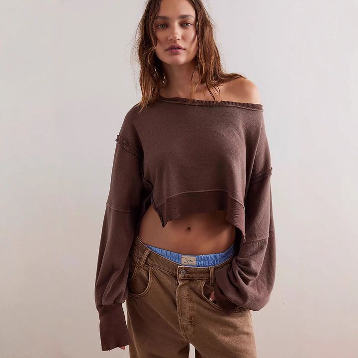 Women's cropped oversized sweatshirt with thumb hole, frayed hem, and wide raglan sleeves Mune Fashion
