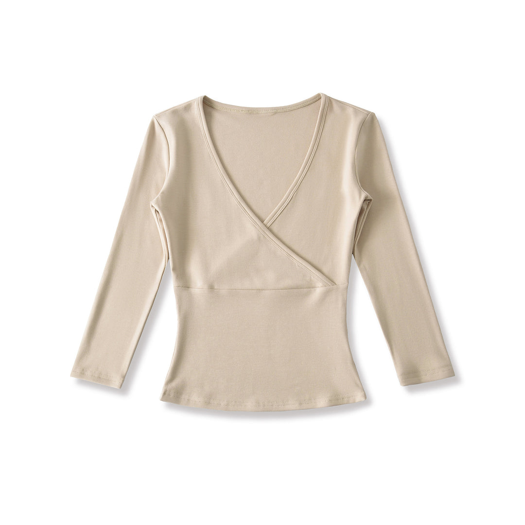 Women's figure-hugging wrap top made of stretch jersey with deep V-neck and tailored silhouette.