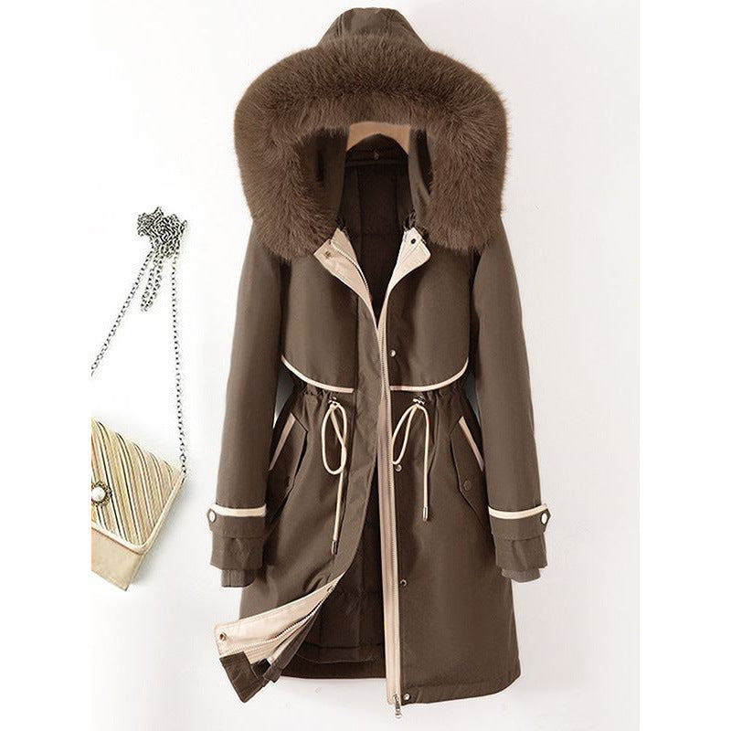 Women's long parka with faux fur hood, waist drawstring, and contrasting piping Mune Fashion