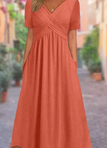 Women's airy V-neck midi dress with crossed bodice, short sleeves, and side pockets Mune Fashion