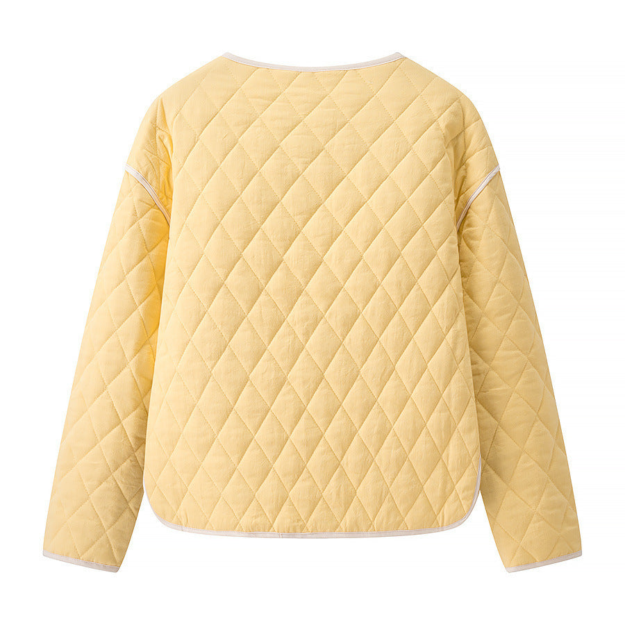 Women's quilted short jacket with diamond quilting, contrasting piping, and rounded hem Mune Fashion