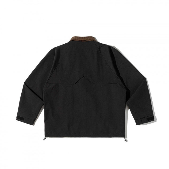 Unisex boxy overshirt jacket in utility style with cord collar, flap pockets and drawstring hem Mune Fashion