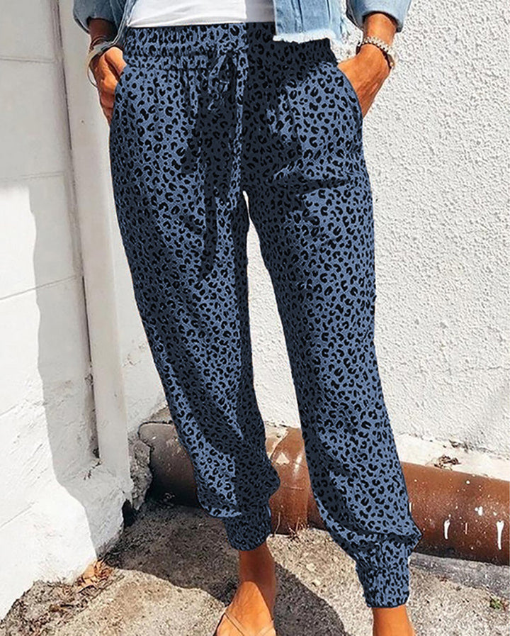 Ladies casual leopard print jogging pants with drawstring, side pockets, and elastic cuffs Mune Fashion