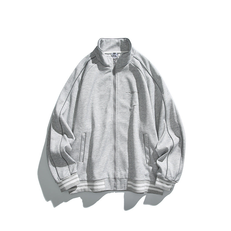Unisex Sportive Track Jacket in oversized cut with stand-up collar, contrast piping and ribbed cuffs Mune Fashion