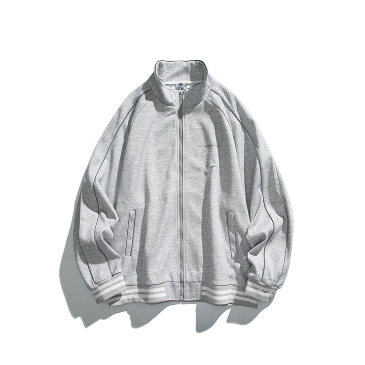 Unisex Sportive Track Jacket in oversized cut with stand-up collar, contrast piping and ribbed cuffs Mune Fashion