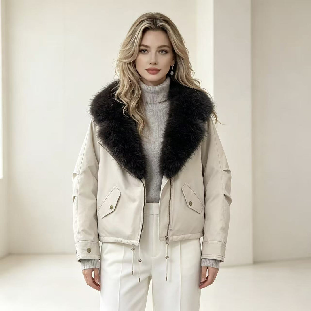 Women's short bomber jacket with voluminous faux fur collar, drawstring hem, and flap pockets Mune Fashion