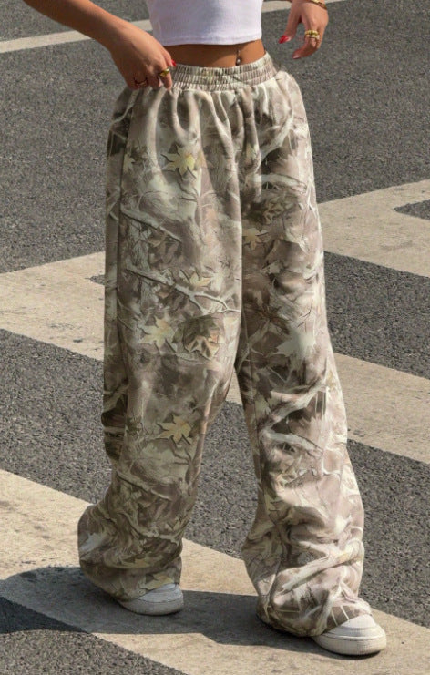 Women's wide Palazzo pants with floral all-over print and elastic waistband Mune Fashion