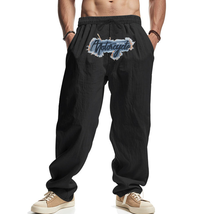 Men's loosely fitting linen look relax pants with elastic waistband, drawstring & front print Mune Fashion