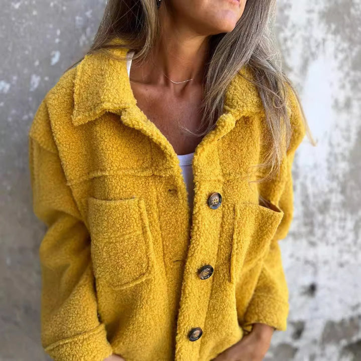 Ladies teddy jacket with large lapel collar, continuous button placket, and patch pockets Mune Fashion