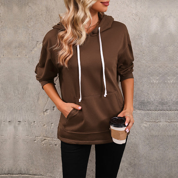 Women's hoodie with kangaroo pocket, loose silhouette and three-quarter sleeves Mune Fashion