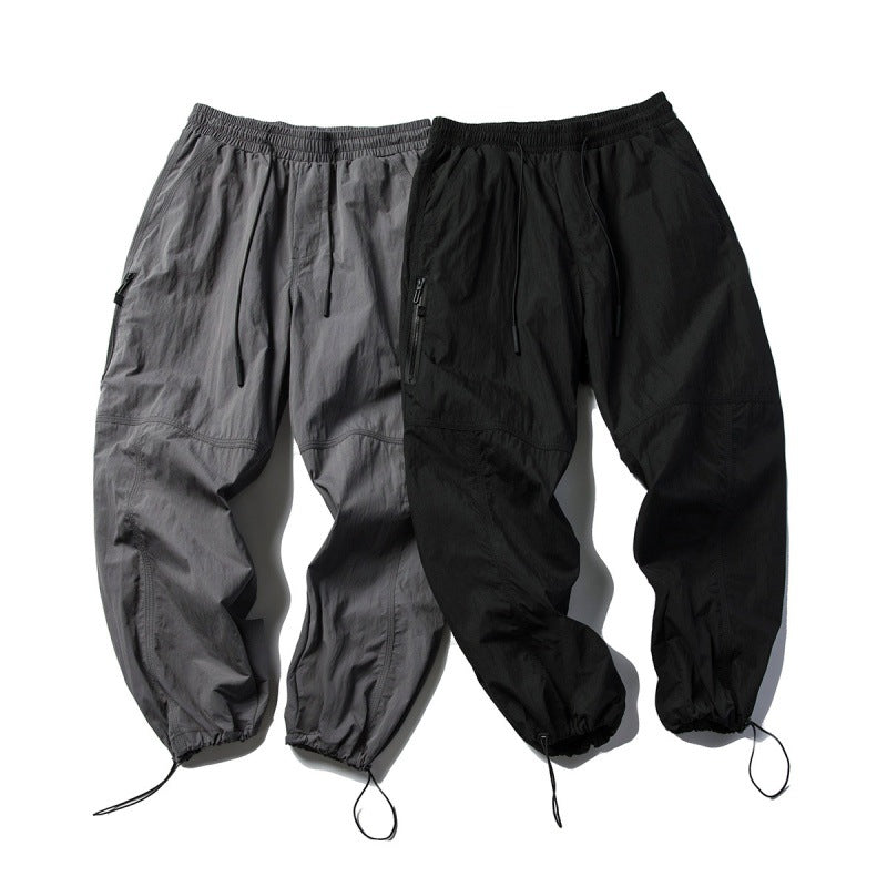 Unisex Technical Cargo Pants in Baggy Cut with Drawstring Waist and Adjustable Leg Closures Mune Fashion